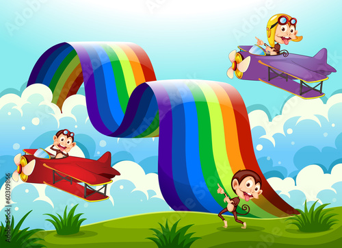 A red and a violet plane with monkeys flying near the rainbow