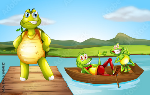 A turtle at the bridge and the two playful frogs at the boat