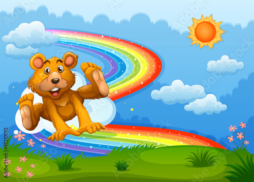 A sky with a bear playing near the rainbow