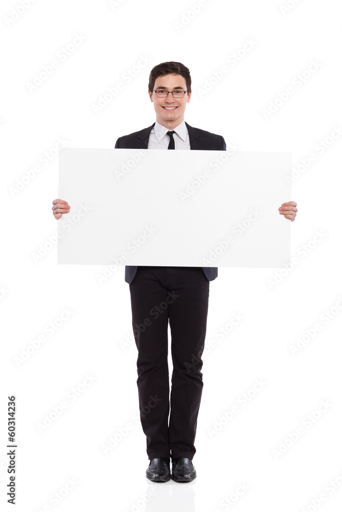 Young male office worker standing with placard.