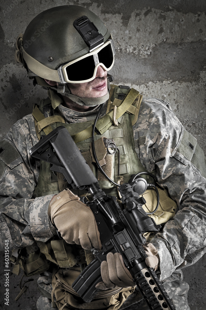 Soldier with rifle and mask on dark background. Soldier with rifle and mask on dark background.