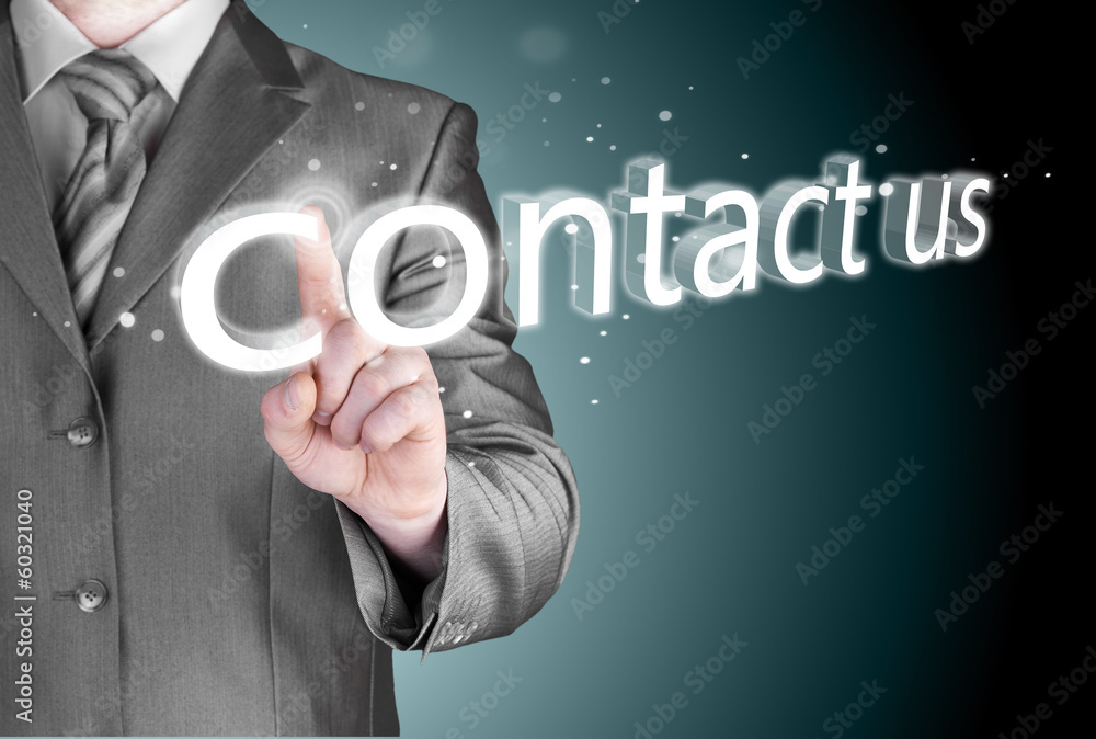 Businessman pushing CONTACT US sign Businessman pushing CONTACT US sign