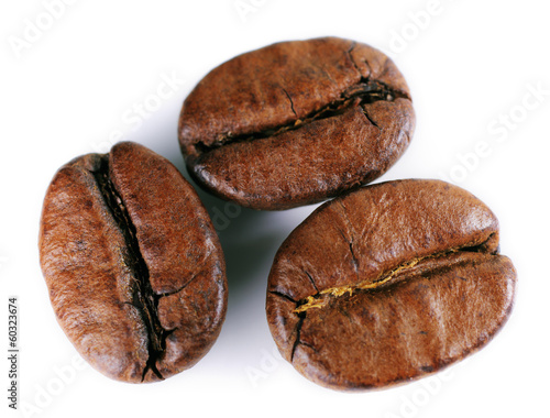 A close-up picture of coffee beans on a white background