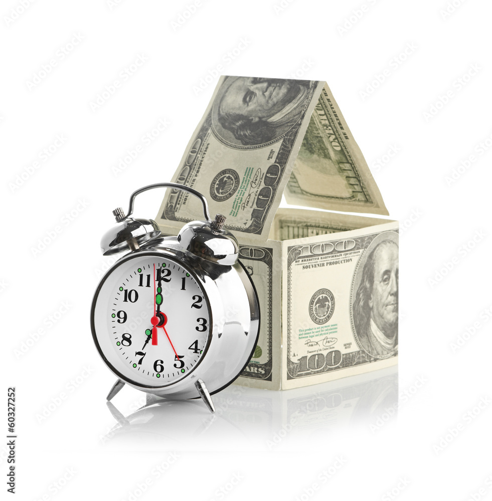 house made of dollars and alarm clock. house made of dollars and alarm clock.