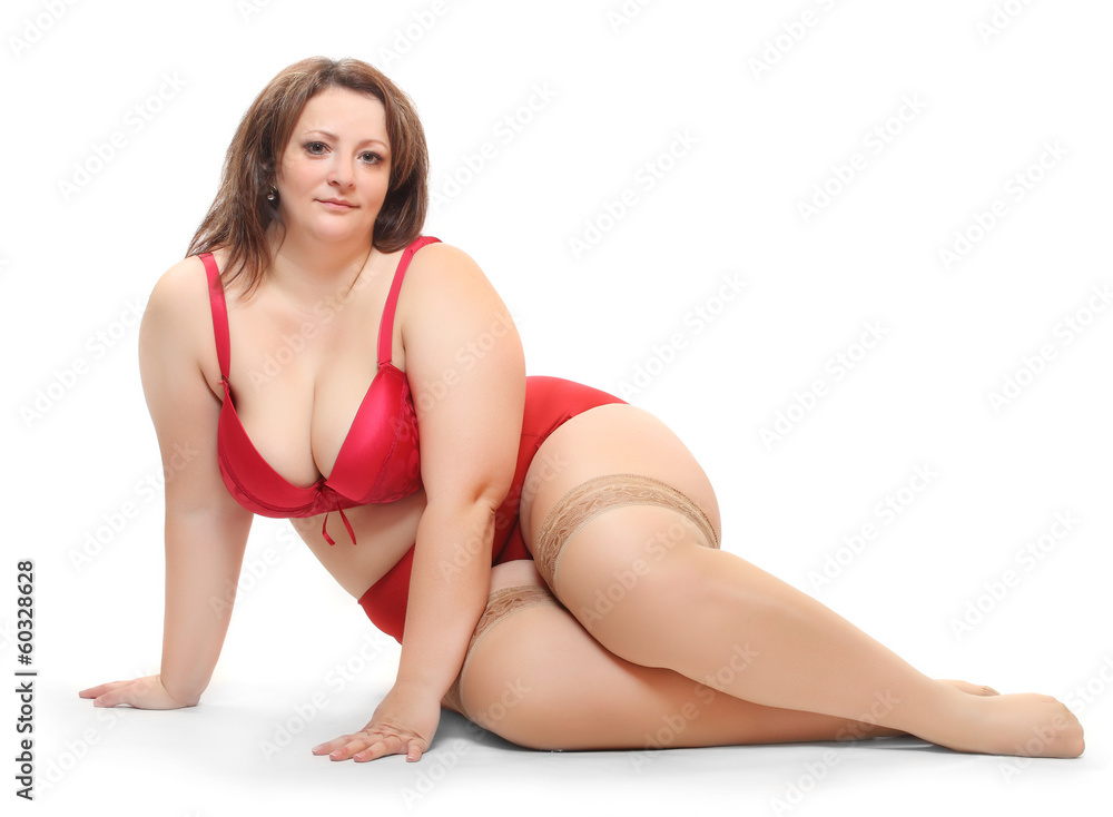 Overweight woman dressed in underwear with nylons. Overweight woman dressed in underwear with nylons.