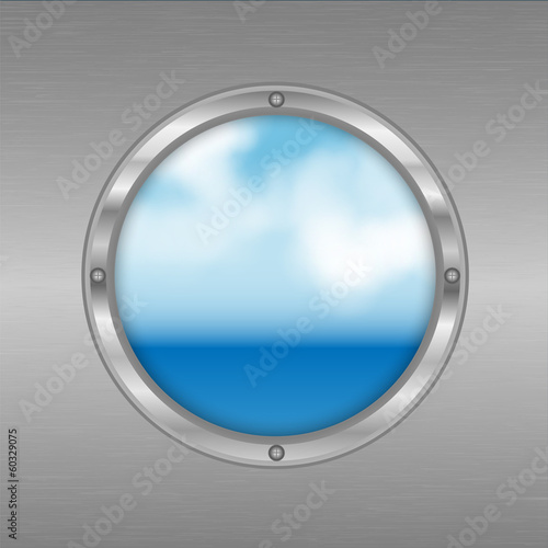 porthole with a view of the sea.sky and ocean outside the window