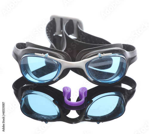 Swimming goggles and plastic nasal clamp.