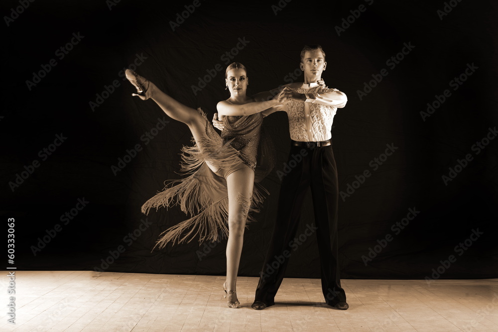 dancers in ballroom against black background dancers in ballroom against black background