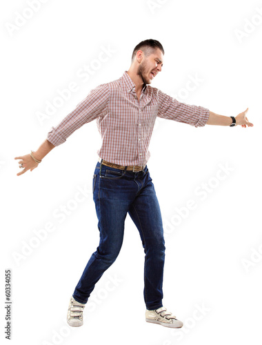 happy young man celebrating success on white background