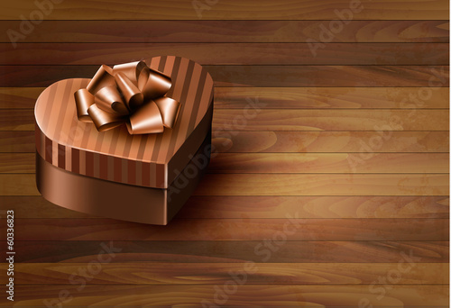 Heart-shaped gift box on wooden background. Vector. © ecco