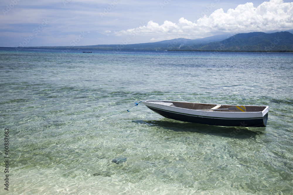 Boat on the blue lagoon of Gili Air, Indonesia 