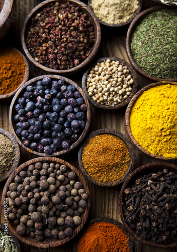 Assortment of spices in wooden bowl background  © Sebastian Duda