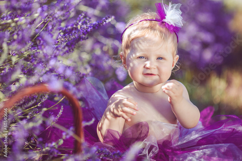 Portrait of an adorable smiling girl in lavender field © GTeam