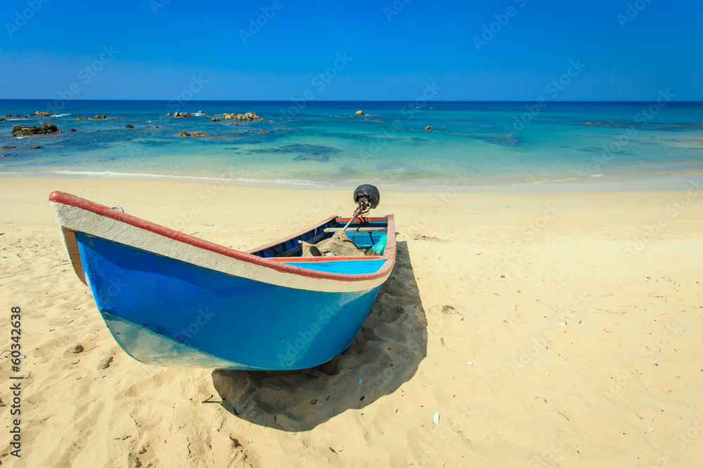 traditional long tail boat stand on the beach in Thailand traditional long tail boat stand on the beach in Thailand