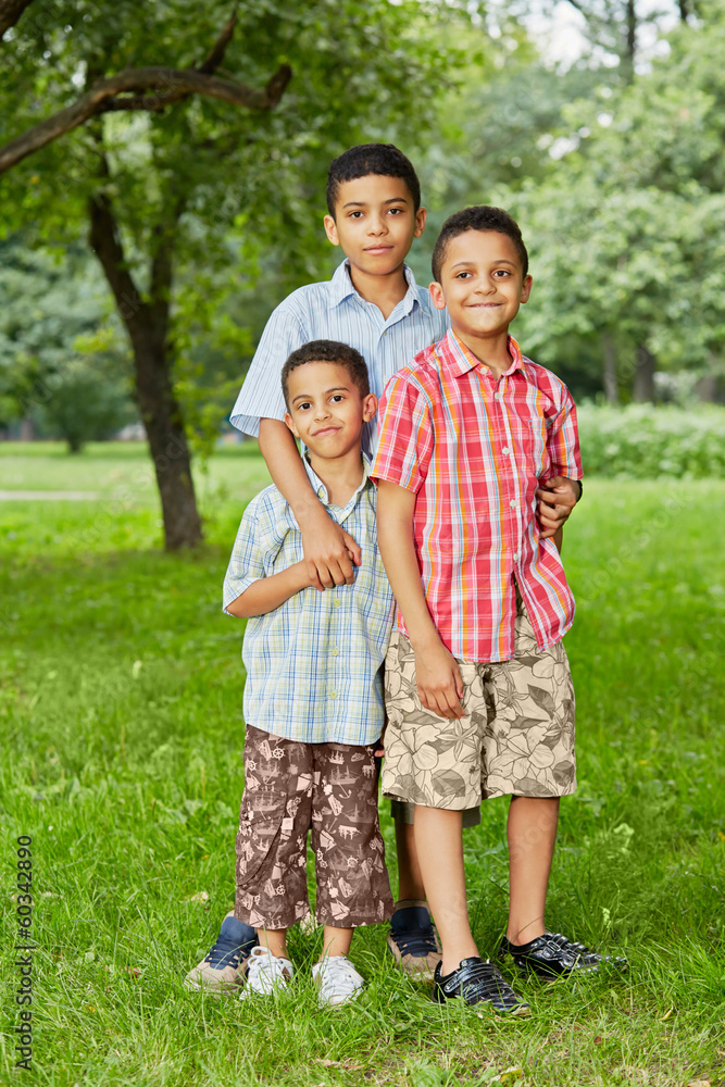 Portrait of three boys-brothers who stand together Portrait of three boys-brothers who stand together
