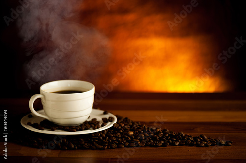 Cup of delicious black coffee on a wooden table