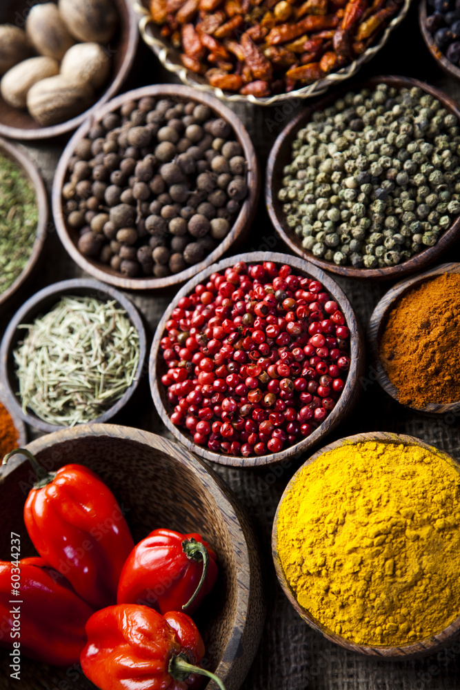 Assortment of spices in wooden bowl background Assortment of spices in wooden bowl background