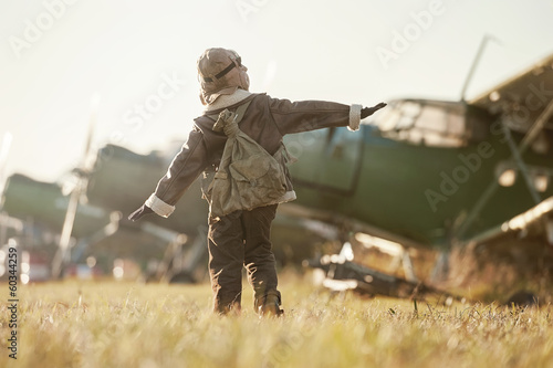 Portrait of a young aviator parked aircraft