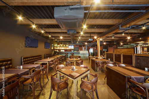 Interior of bar with wooden furniture