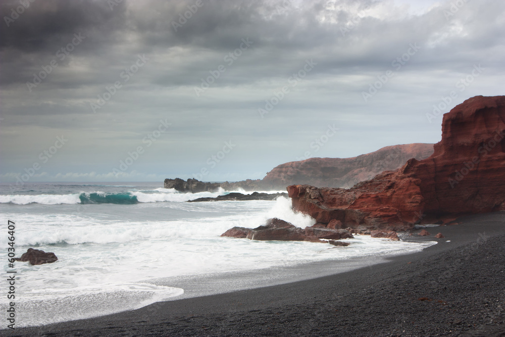 Volcanic beach on overcast day Volcanic beach on overcast day