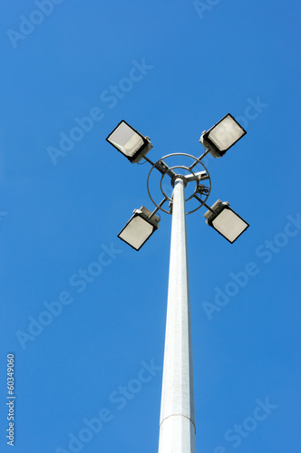 spotlights against a blue sky