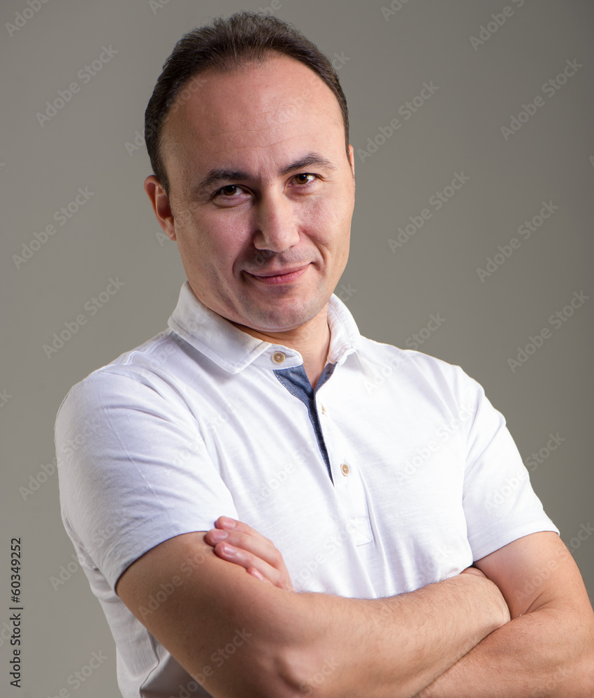 Smiling Businessman Looks into the Camera. Smiling Businessman Looks into the Camera.