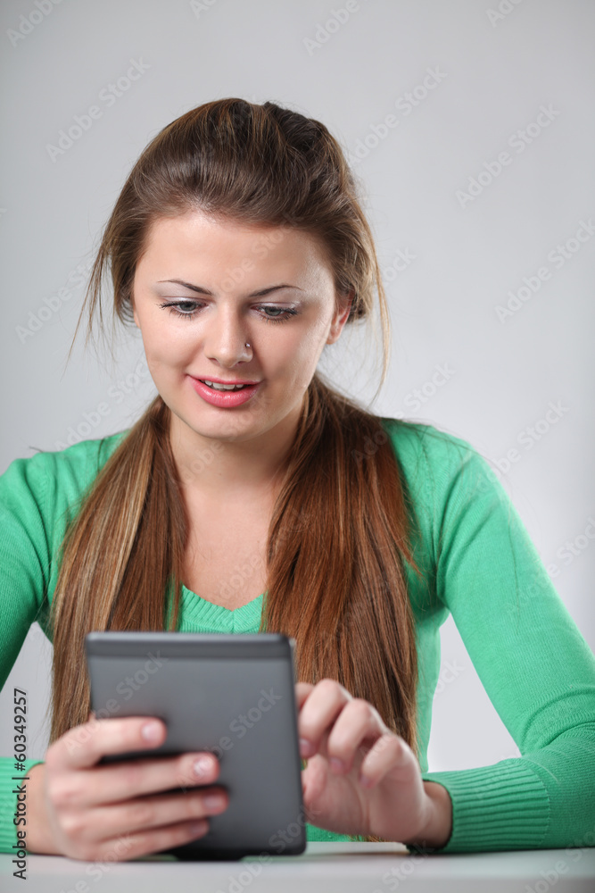 Young womanholding computer plane-table Young womanholding computer plane-table