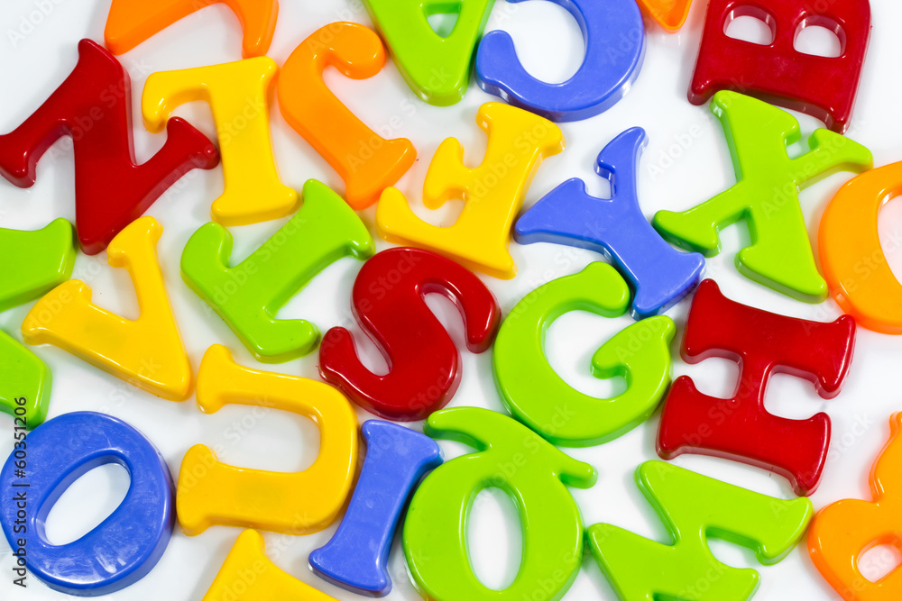 Fototapeta premium Plastic letters scattered on white background.