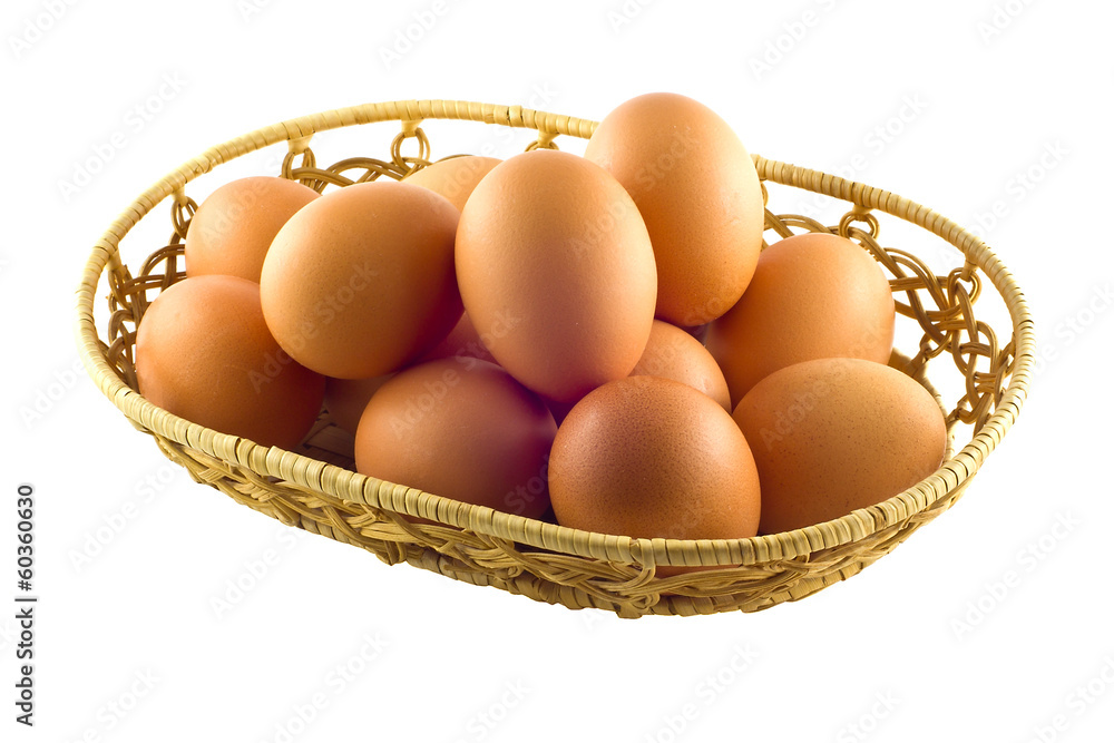 Brown eggs in the basket on white Brown eggs in the basket on white