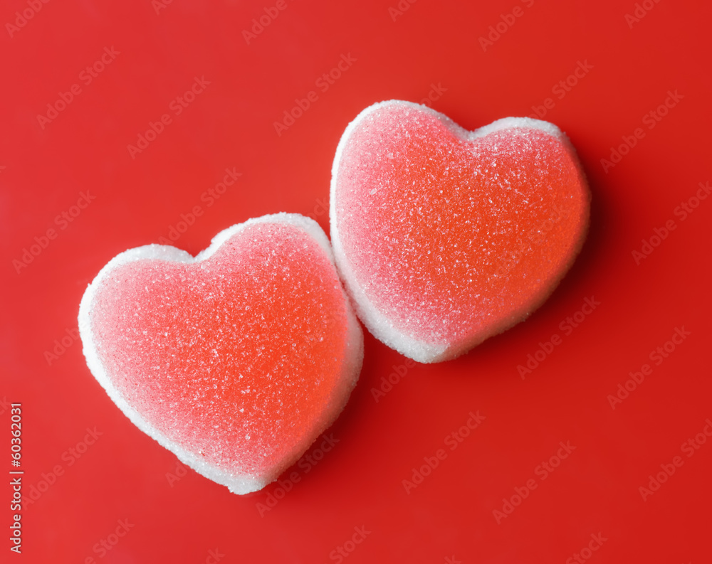 Sugar hearts on red background Sugar hearts on red background