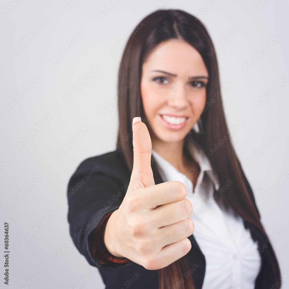 Gorgeous businesswoman showing thumb up Gorgeous businesswoman showing thumb up