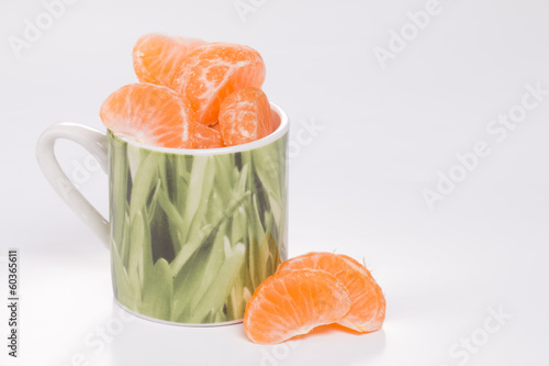 Mandarin in green cup.