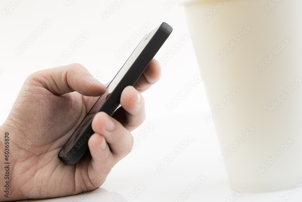 Businessman Using Cell Phone with coffee cup Businessman Using Cell Phone with coffee cup