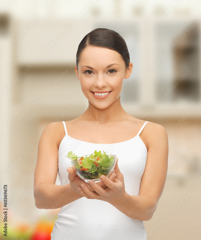 healthy woman holding bowl with salad in kitchen healthy woman holding bowl with salad in kitchen