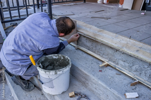 Worker Install Ceramic Stairs Tile 2 © kalpis
