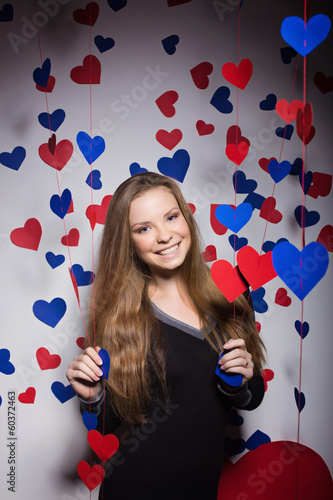 Valentine's Day. smiling woman with a gift in the form of heart