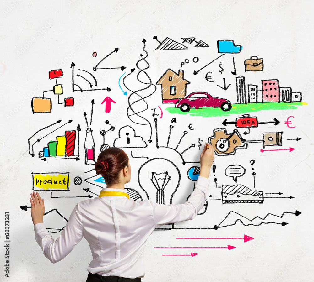 Businesswoman drawing on wall Businesswoman drawing on wall