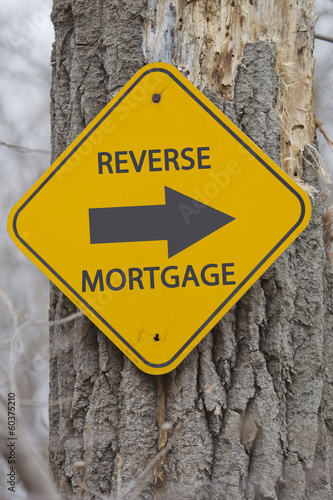 Reverse Mortgage Arrow sign on tree