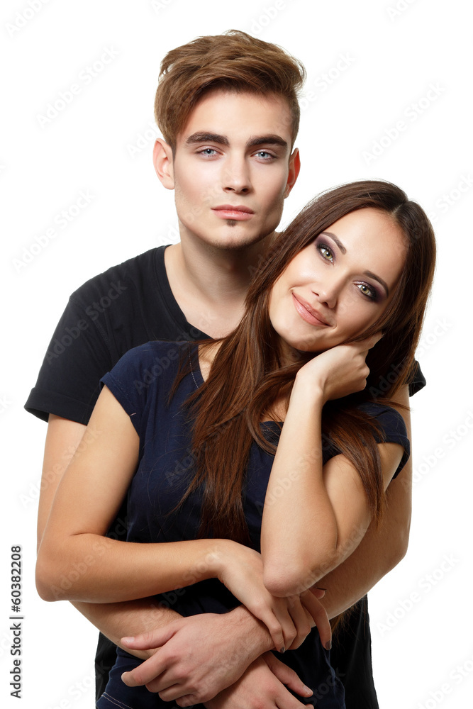 Young couple, beautiful young man and woman closeup, studio shot Young couple, beautiful young man and woman closeup, studio shot