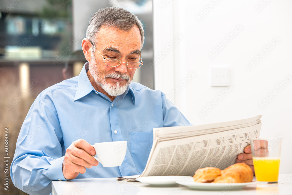 Senior man with a newspaper Senior man with a newspaper
