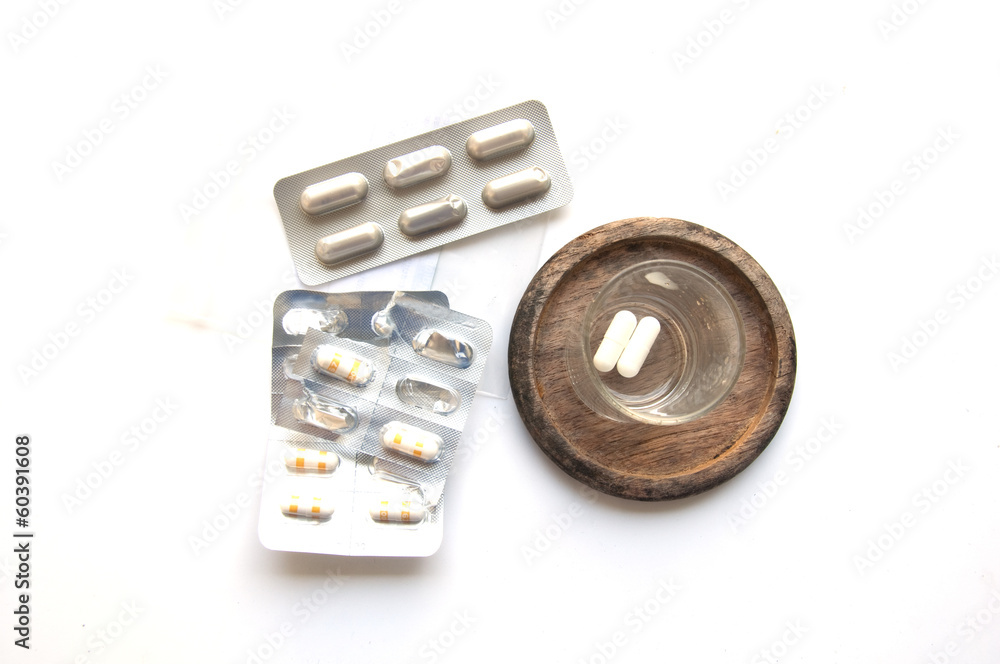 Capsule pill and glass of water Capsule pill and glass of water