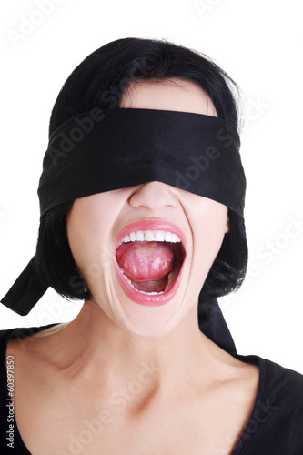 Portrait of young blindfold woman screaming