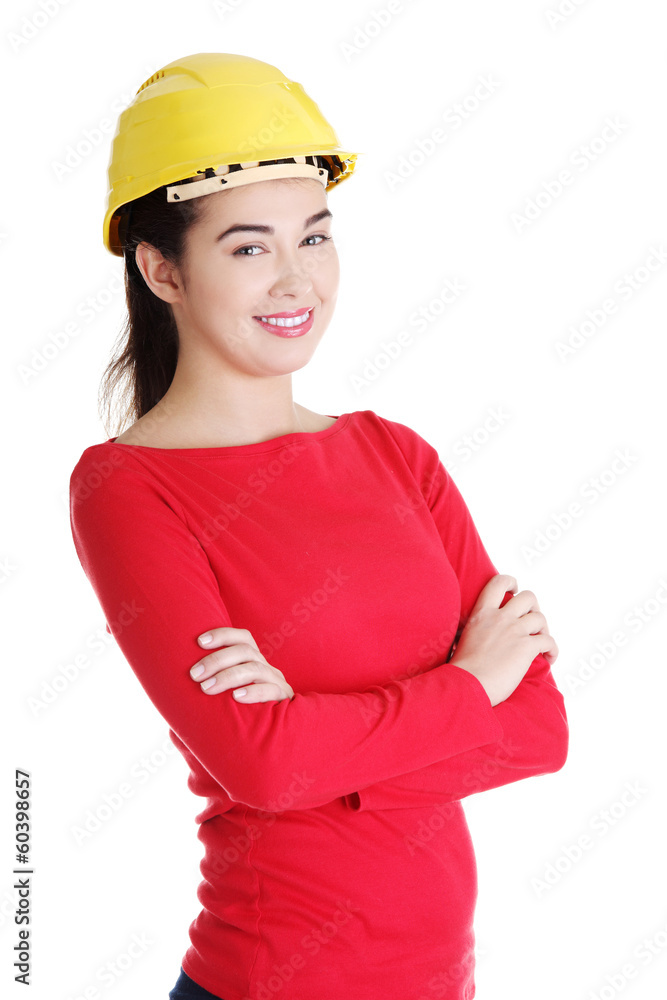 Portrait of confident female worker in helmet. Portrait of confident female worker in helmet.