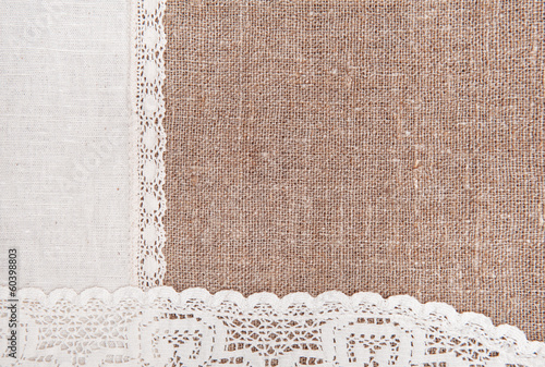 Burlap background with lacy and linen cloth