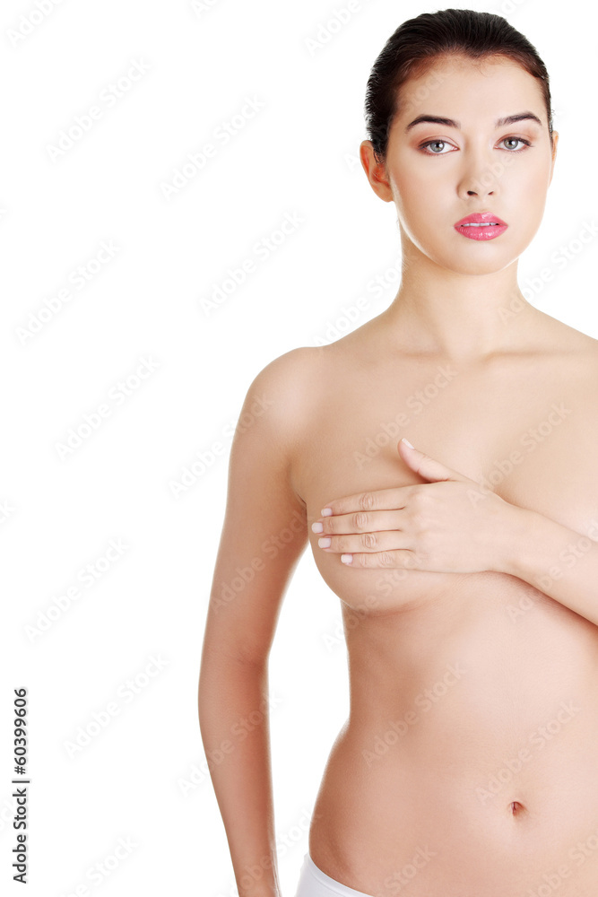 Obraz premium Woman holding her breast