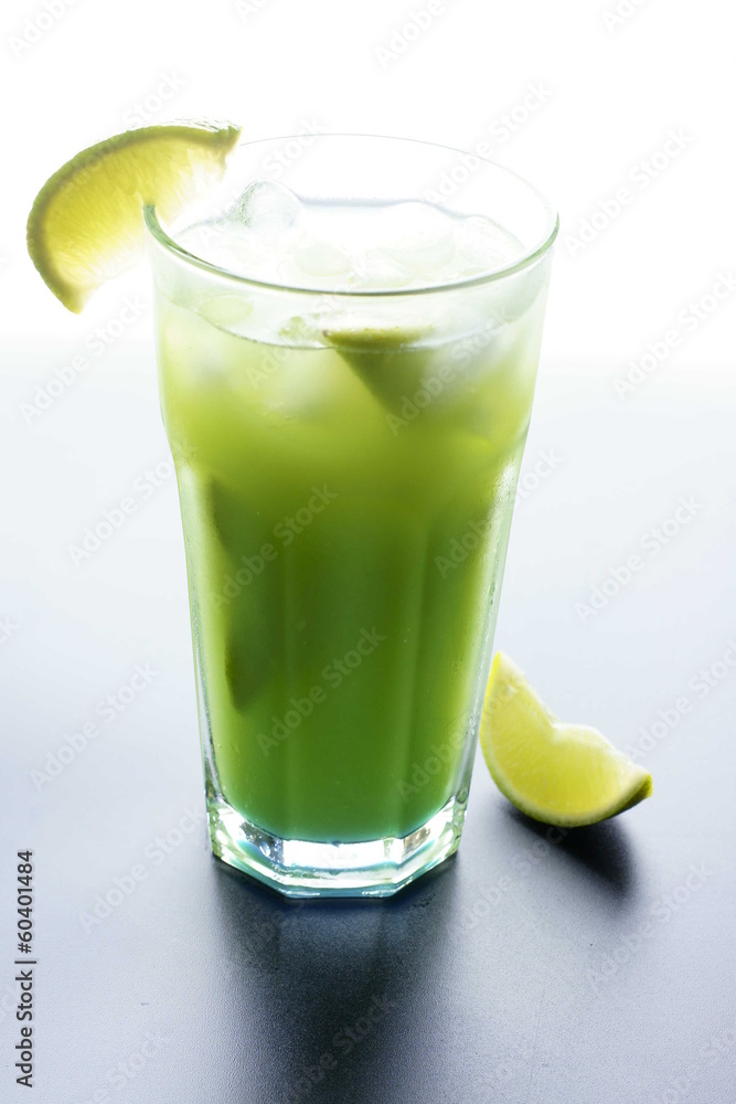 Green cocktail with lime, isolated on white background