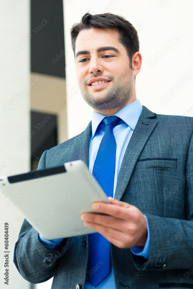 Businessman using tablet computer Businessman using tablet computer