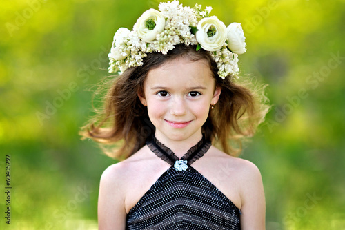 portrait of little girl outdoors in summer photo