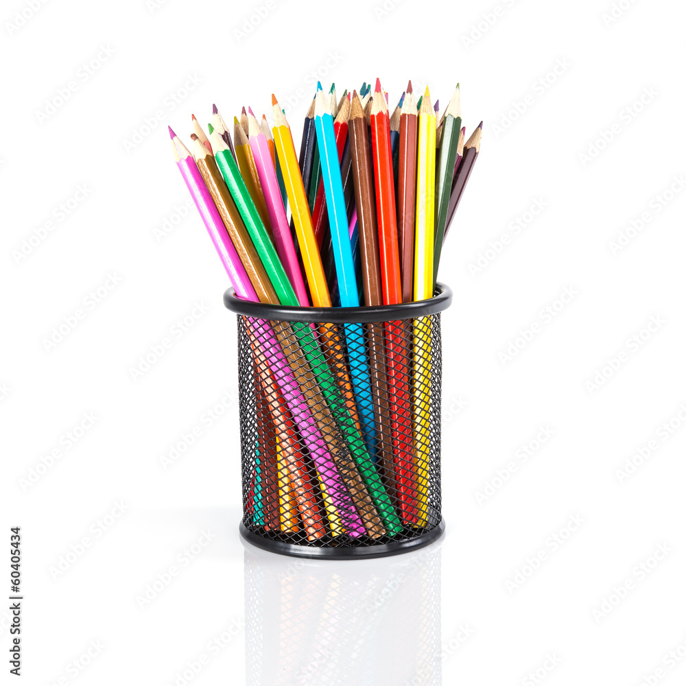 Fototapeta premium Colorful pencils in a black basket over a white background