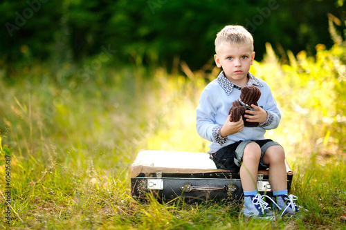 portrait of little stylish boy outdoors